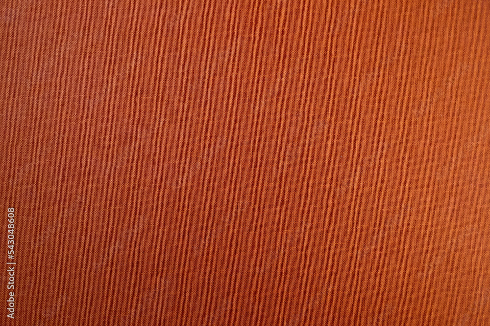Fototapeta premium Orange background from natural colored fabric