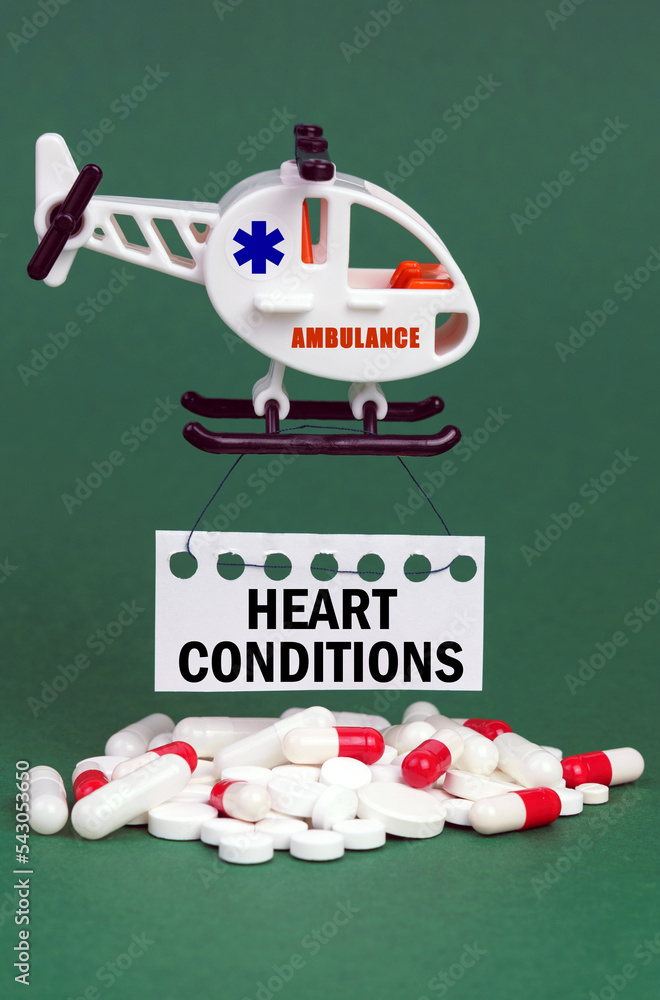 Φωτογραφία On a green surface, an ambulance helicopter, pills and a white sign with the ins