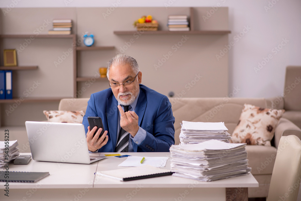 Old male boss working from home during pandemic Old male boss working from home during pandemic