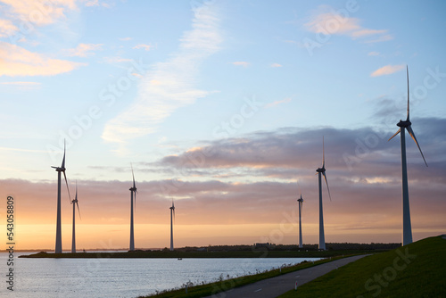 Philipsdam, Zeeland, Netherlands - October 22 2022: Windmills during a beautifull sunrise. photo