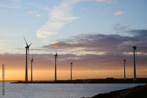 Philipsdam, Zeeland, Netherlands - October 22 2022: Windmills during a beautifull sunrise. photo