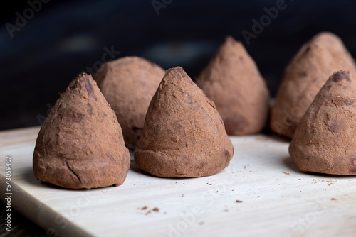 Chocolate truffle candy on the board © rsooll