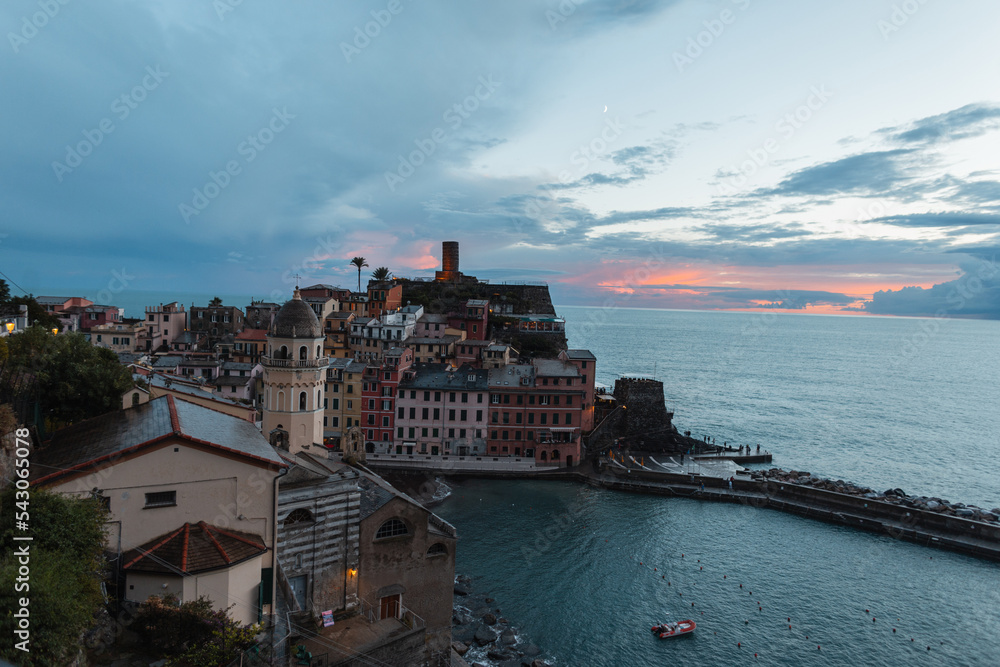 Amazing village with vintage houses on a rock by the sea at sunset in Vernazza, Italy