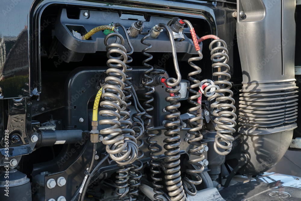 Pressure hoses, electrical wires and cables on a black european truck for  coupling the truck with a trailer. Stock-Foto | Adobe Stock