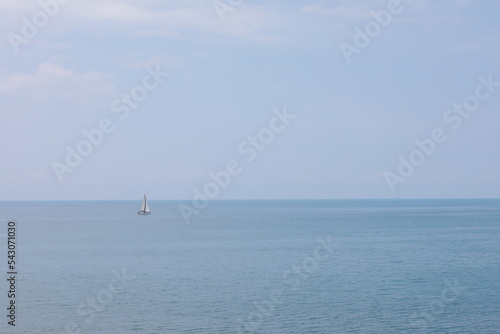 Sailboat on the blue sea