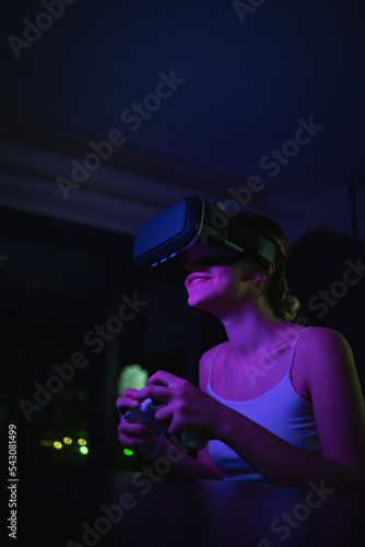 woman in vr glasses plays virtual reality game in metaverse universe and experiences different emotions