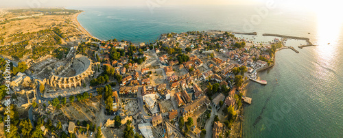 Aerial panoramic cityscape of Side, a resort town, in Antalya Province, Turkey, surrounded by the Mediterranean Sea, during the sunset,. High quality photo