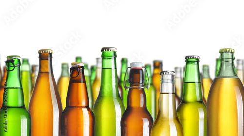 Collection of beer bottles without labels  isolated