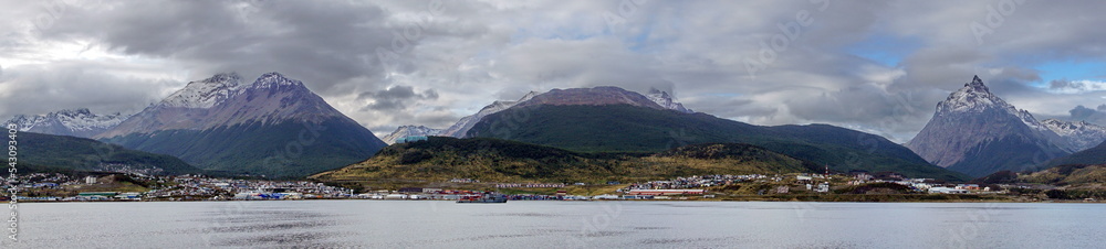 Panorama of the city of Ushuaia, Argentina, below the mountains, seen from the Beagle Channel