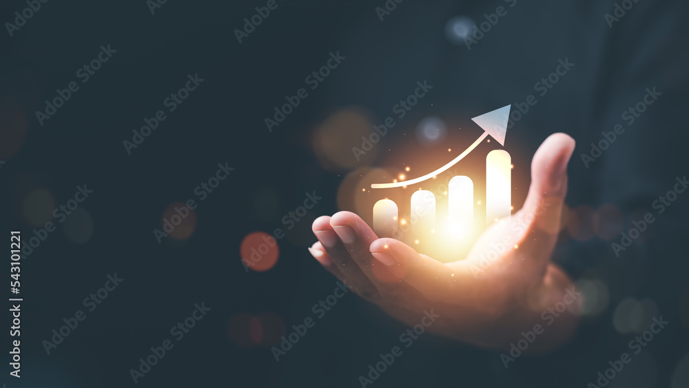 Businessman showing business growth and success graph ,concept of progress in development, financial efficiency and investment with business strategy for goals and opportunities in the industry future - obrazy, fototapety, plakaty 