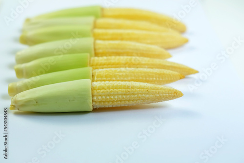 Arrangement of young corn isolated on a white background, young corn is used as a vegetable