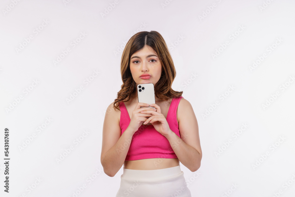 Portrait of confused young woman using mobile phone isolated over white background Portrait of confused young woman using mobile phone isolated over white background