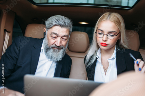 business team working together in the car