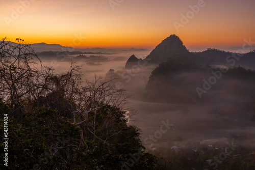 View of flowing fog on mountain tropical rainforest in the morning