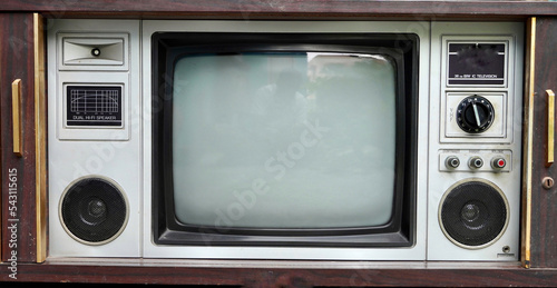 Vintage tv set. Vintage old fashioned TV isolated in home. Classic retro style old television with wooden door type.