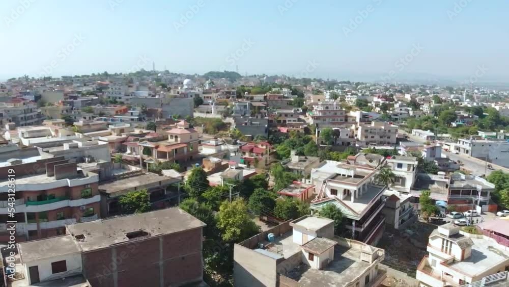 aerial view of city in clear sky with large buildings in 4K. Urban city scape aerial view of city in clear sky with large buildings in 4K. Urban city scape