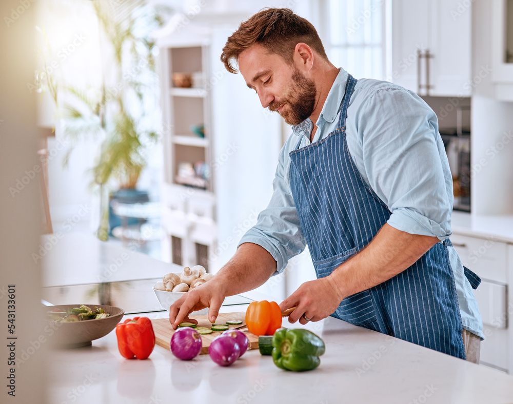 Man, chef and cooking, cut vegetable in kitchen and healthy with diet, nutrition and vitamins preparing dinner or lunch meal. Food at home with apron and organic, fresh pepper and onion. Man, chef and cooking, cut vegetable in kitchen and healthy with diet, nutrition and vitamins preparing dinner or lunch meal. Food at home with apron and organic, fresh pepper and onion.