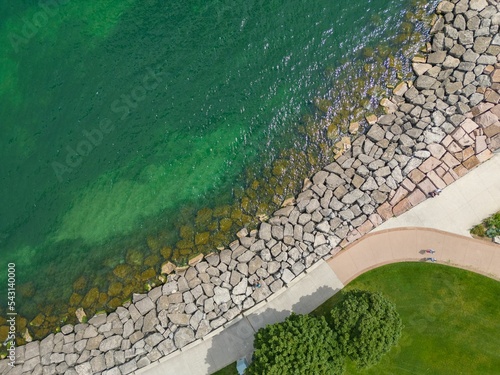 Top view of the Lake Ontario rocky shore and greenery