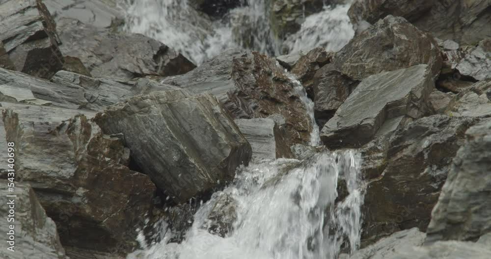 Water runs thru rocks and bedrock in slow motion Water runs thru rocks and bedrock in slow motion