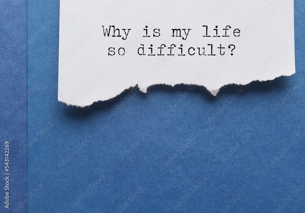 Torn paper on blue book with text typed question Why is my life so