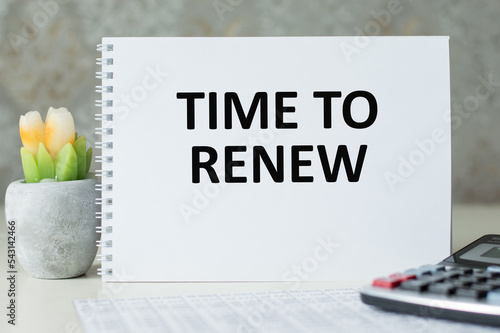 Time to Renew notepad writing on the white background with alarm clock