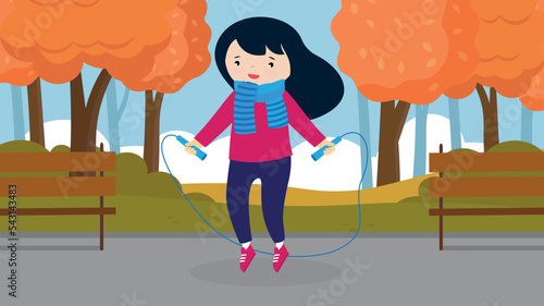 girl jumping rope in autumn park