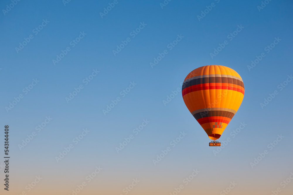 Fototapeta premium Balloon at dusk in Cappadocia. Famous flight in Goreme. Turkey