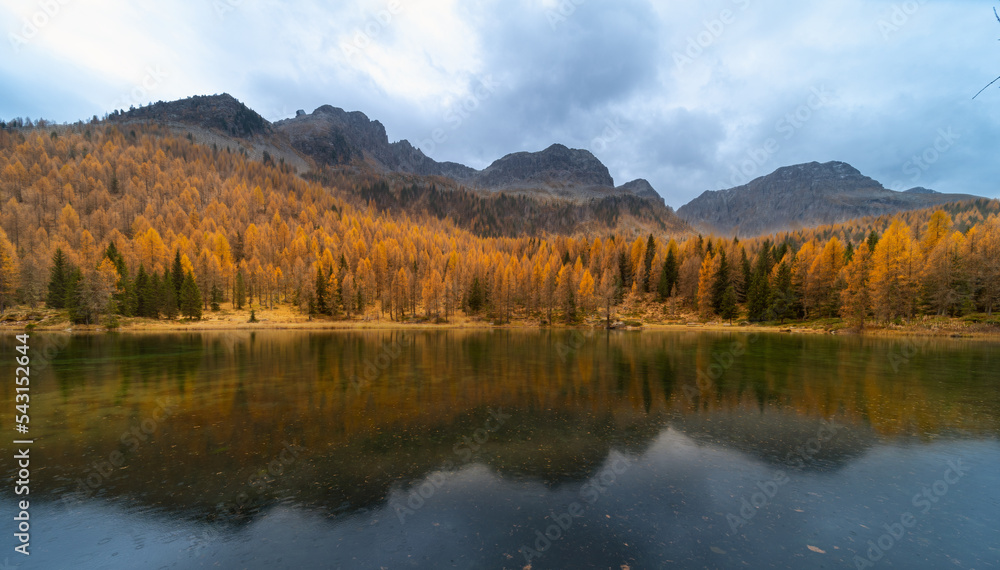 Amazing Autumn landscape on mountians lake. Dolomites Italy