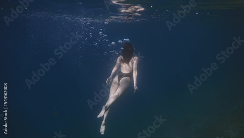 Cure girl swimming underwater, adriatic sea