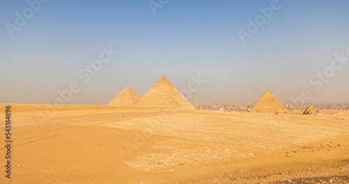 Great Pyramids of Giza from Cairo in an amazing sunset light, landmark historical construction buildings from Egypt.