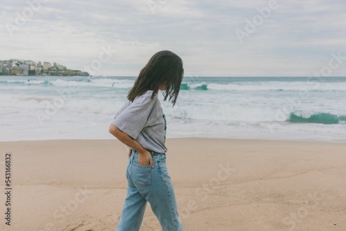 Wide Shot Of A Woman Walking  The Beach