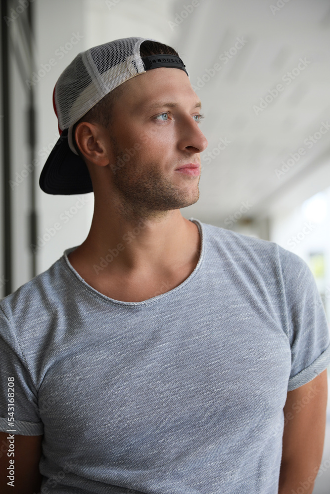 Portrait of handsome young man in stylish cap outdoors Portrait of handsome young man in stylish cap outdoors