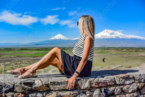 Young girl on the background of a beautiful view of mount Ararat in the afternoon. Armenia2019