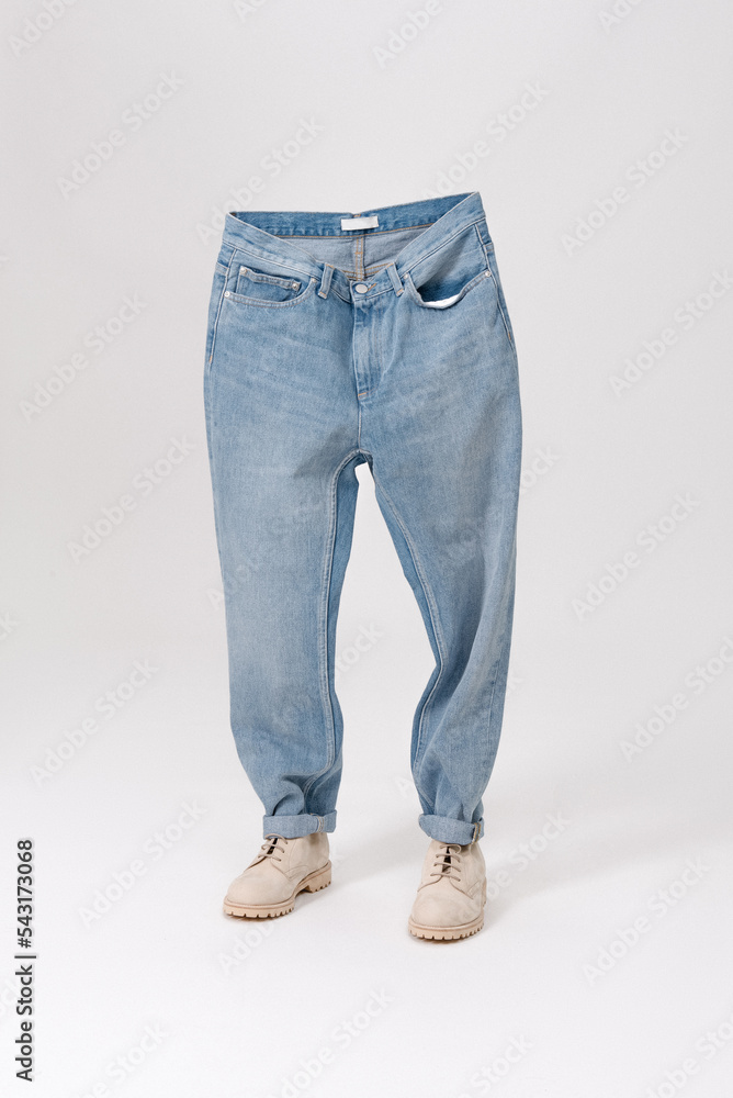 Blue jeans with shoes. Creative idea of photographing clothes. Advertising comfortable jeans