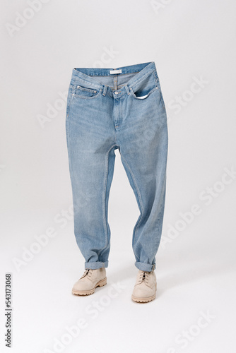 Obraz na płótnie Blue jeans with shoes. Creative idea of photographing clothes. Advertising comfortable jeans w salonie