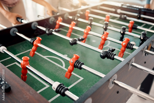 Obraz na plátně Foosball, game and fun with people playing a game inside of a clubhouse or at a party together