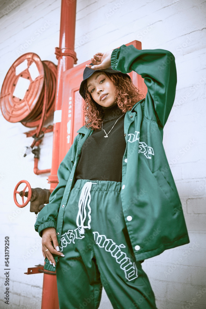 Fashion, wall and black woman with green clothes, fashionable style or cool hip hop outfit. Fire hose, attitude or portrait of gen z girl with trendy streetwear, designer brand or 2000s rap aesthetic - obrazy, fototapety, plakaty 