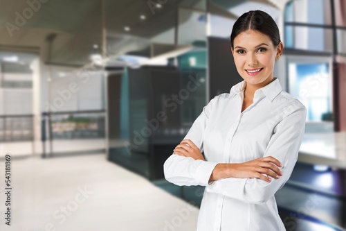 Happy business woman posing at work