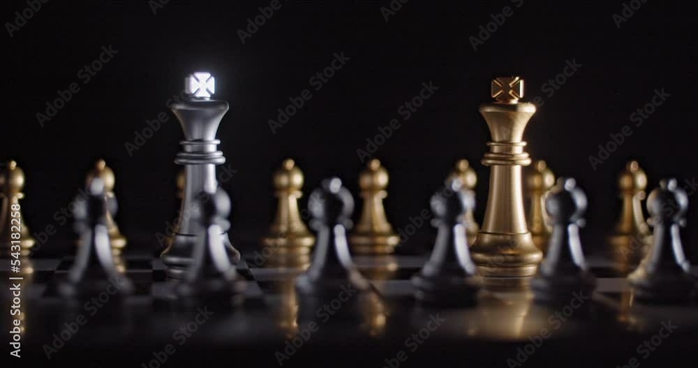 Cinematic shot of two kings facing off on a chess board surrounded by pawns. Cinematic shot of two kings facing off on a chess board surrounded by pawns.