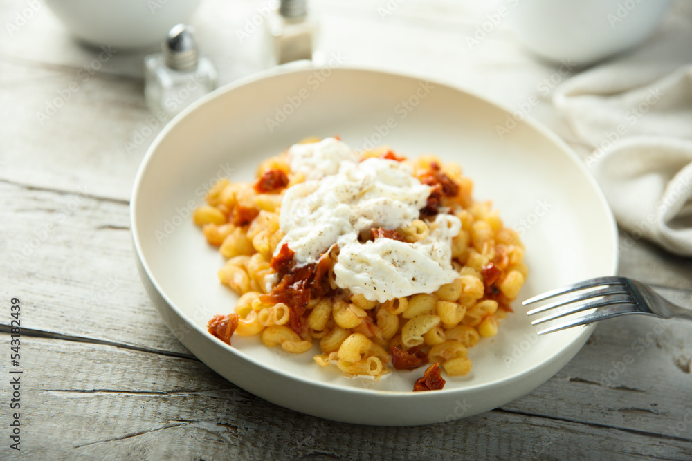 Pasta with fresh cheese and tomatoes Pasta with fresh cheese and tomatoes