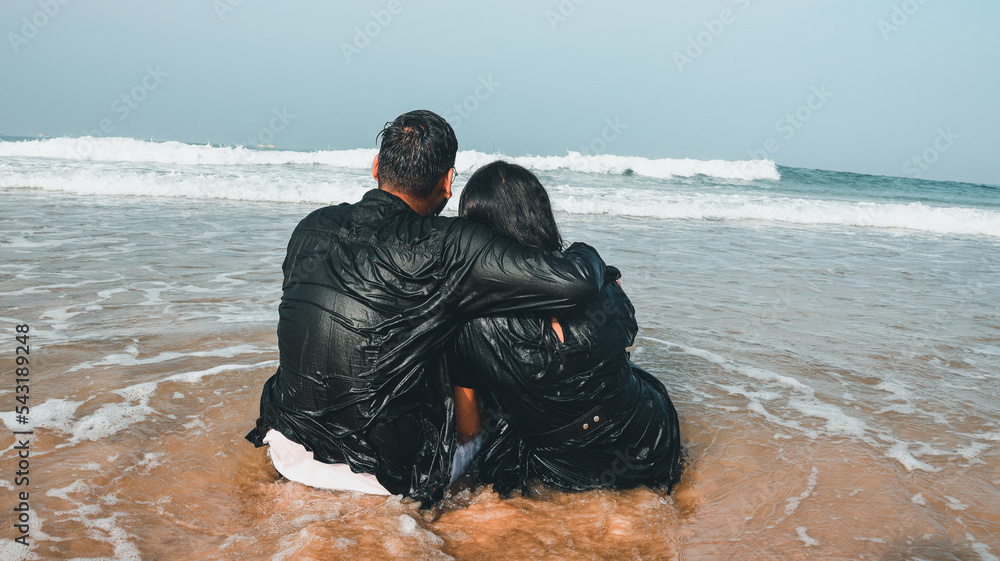 A young lovely attractive romantic Indian couple looking at each other ...
