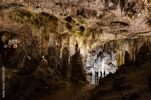 Under the ground. Beautiful view of stalactites and stalagmites in an underground cavern - Postojna cave  Slovenia  Europe