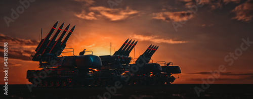 armored personnel carrier equipped with rockets and weapons backdround sky in the morning, 3d render and illustrater. photo