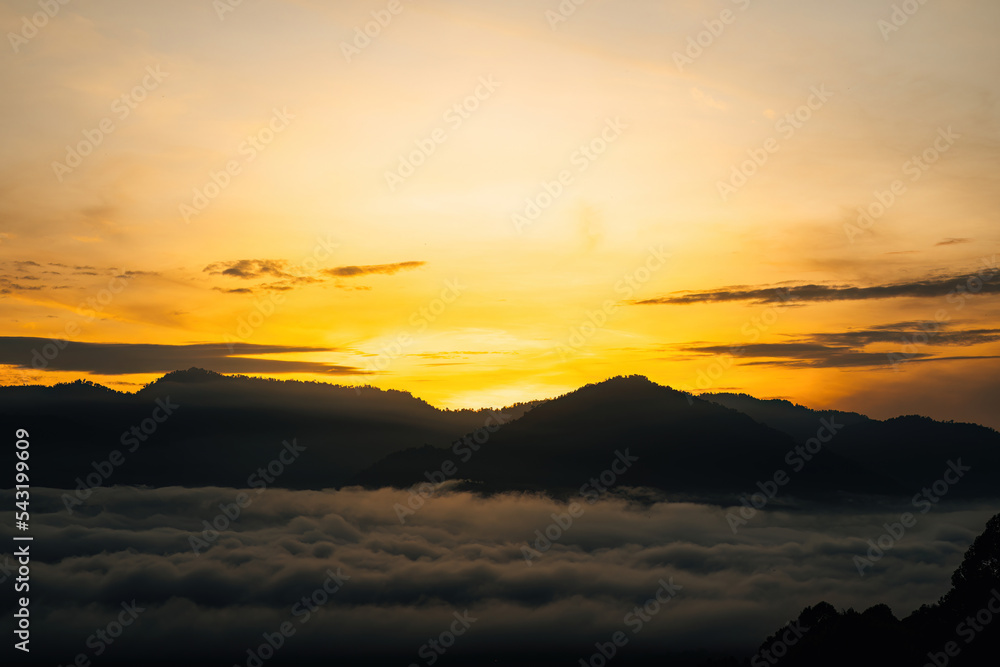 Sea clouds during golden sunrise above the Titiwangsa range mountains in Lenggong, Perak.