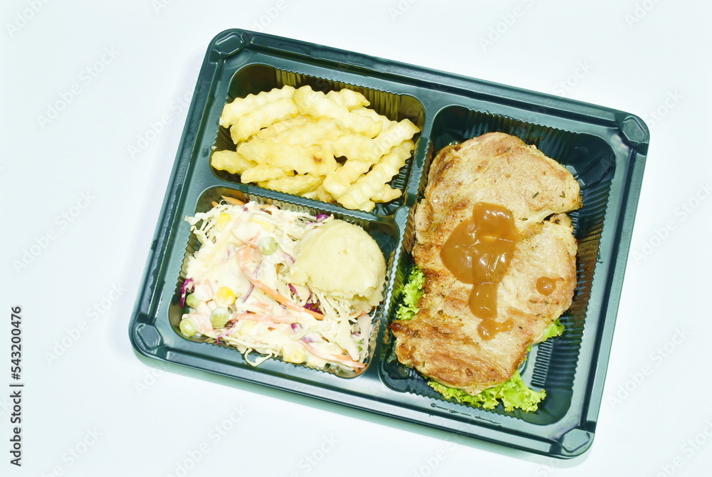 grilled pork black pepper steak dressing gravy sauce with mashed potato and salad dipping chili sauce on plastic packaging to take home grilled pork black pepper steak dressing gravy sauce with mashed potato and salad dipping chili sauce on plastic packaging to take home