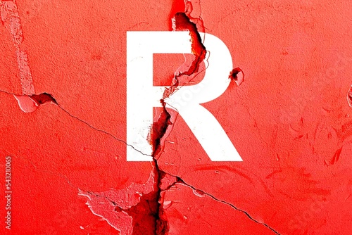 Letter R background with red color painted on broken wall with cracks, abstract US (United States) Republican Party politics concept
