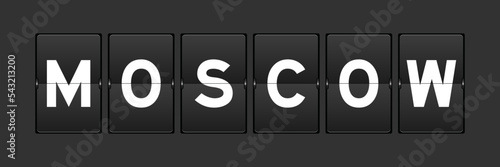 Black color analog flip board with word moscow on gray background