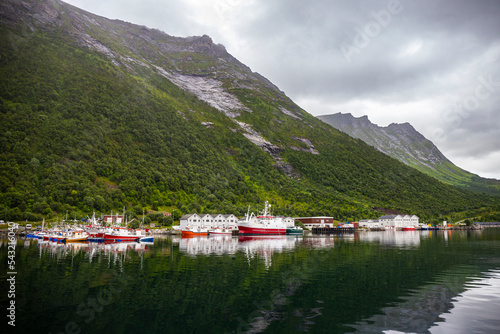 panorama of senja island, norway, overlooking the small island of husoy and its harbour; the famous norwegian fjords photo