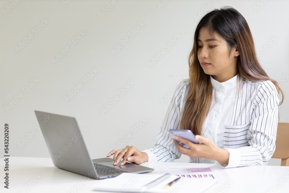 Businesswoman in the office working on business financial reports analyzing company financial statistics and making accounting. Businesswoman in the office working on business financial reports analyzing company financial statistics and making accounting.