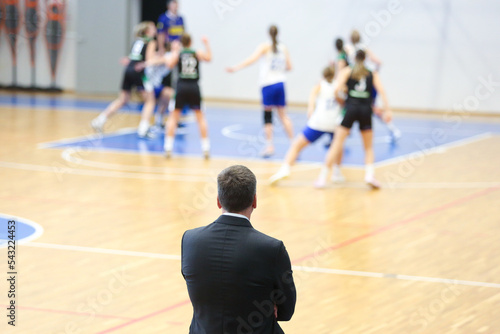 Basketball coach watching the match